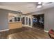 Living room with hardwood floors, kitchen island, and sliding glass doors leading to the backyard at 2505 Laurie Dr, Las Vegas, NV 89102