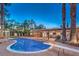 Inviting kidney-shaped pool with a relaxing sitting area and a sliding board at 2505 Laurie Dr, Las Vegas, NV 89102