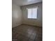 Small bedroom with tile floors and a window at 2567 Paradise Village Way, Las Vegas, NV 89120