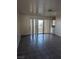 Living room with tile floors and sliding glass door at 2567 Paradise Village Way, Las Vegas, NV 89120