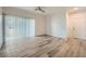 Living room with wood-look floors and sliding door at 2900 Sunridge Heights Pkwy # 1514, Henderson, NV 89052