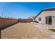 Large backyard with gravel, patio, and storage shed at 2905 Carothers Ct, North Las Vegas, NV 89032