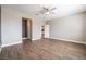 Bright bedroom with wood-look flooring and ceiling fan at 2905 Carothers Ct, North Las Vegas, NV 89032