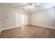 Bright bedroom with double doors and wood-look floors at 2905 Carothers Ct, North Las Vegas, NV 89032