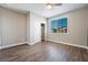 Spacious bedroom with wood-look floors and ceiling fan at 2905 Carothers Ct, North Las Vegas, NV 89032