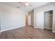 Bright bedroom featuring wood-look floors and ample closet space at 2905 Carothers Ct, North Las Vegas, NV 89032