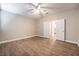 Spacious bedroom with double doors and wood-look floors at 2905 Carothers Ct, North Las Vegas, NV 89032