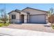 Front view of the house with a brick driveway at 2905 Carothers Ct, North Las Vegas, NV 89032