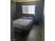 Bedroom with gray walls, wood-look floors and window at 2962 Juniper Hills Blvd # 203, Las Vegas, NV 89142