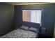 Bedroom with gray walls, wood-look floors and window at 2962 Juniper Hills Blvd # 203, Las Vegas, NV 89142