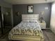 Bedroom with a queen-size bed and gray walls at 2962 Juniper Hills Blvd # 203, Las Vegas, NV 89142