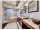 Elegant bathroom with double vanity and soaking tub at 30 Via Mantova # 108, Henderson, NV 89011