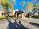 Spanish-style building exterior with palm trees at 30 Via Mantova # 108, Henderson, NV 89011