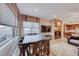 Bright dining area with large windows and wood table at 30 Via Mantova # 108, Henderson, NV 89011