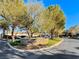 Community entrance with landscaping and signage at 30 Via Mantova # 108, Henderson, NV 89011