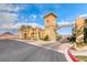 Community entrance with grand architecture and landscaping at 30 Via Mantova # 108, Henderson, NV 89011