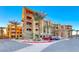 Luxury condo building with palm trees and ample parking at 30 Via Mantova # 108, Henderson, NV 89011