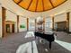 Elegant lobby with high ceilings and a grand piano at 30 Via Mantova # 108, Henderson, NV 89011