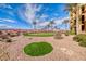 Relaxing putting green with palm trees and desert landscaping at 30 Via Mantova # 108, Henderson, NV 89011