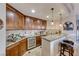 Wet bar with granite countertop and wine refrigerator at 30 Via Mantova # 108, Henderson, NV 89011