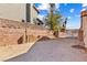 Backyard with block wall, gate, and stacked tiles at 3139 Ocotillo Dr, Laughlin, NV 89029