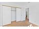 Bedroom with mirrored closet doors and wood-look tile flooring at 3139 Ocotillo Dr, Laughlin, NV 89029