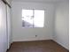 Bedroom with tile floors, sliding door, and closet at 3139 Ocotillo Dr, Laughlin, NV 89029