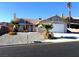 Single-story home with a two-car garage and desert landscaping at 3139 Ocotillo Dr, Laughlin, NV 89029