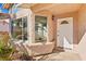 Front entryway with a white door and bay window at 3139 Ocotillo Dr, Laughlin, NV 89029