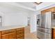 Kitchen boasts stainless steel refrigerator and wood cabinets at 3139 Ocotillo Dr, Laughlin, NV 89029