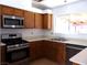 Stainless steel appliances and light wood cabinets in kitchen at 3139 Ocotillo Dr, Laughlin, NV 89029