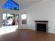 Bright living room with a fireplace and large windows at 3139 Ocotillo Dr, Laughlin, NV 89029