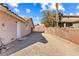 Gravel driveway and gated access to the backyard at 3139 Ocotillo Dr, Laughlin, NV 89029