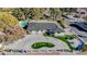 Stunning aerial view of house, landscaping, and circular driveway at 3180 S Tioga Way, Las Vegas, NV 89117