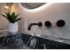 Modern bathroom sink with black faucet and marble countertop at 3180 S Tioga Way, Las Vegas, NV 89117