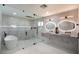 Luxurious bathroom boasts double sinks, a soaking tub, and a glass shower at 3180 S Tioga Way, Las Vegas, NV 89117