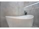 Freestanding soaking tub with modern faucet at 3180 S Tioga Way, Las Vegas, NV 89117