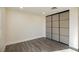 Bright bedroom with light walls and laminate wood flooring at 3180 S Tioga Way, Las Vegas, NV 89117