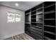 Bright walk-in closet with built in shelves at 3180 S Tioga Way, Las Vegas, NV 89117