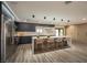 Virtually staged kitchen featuring a large island and modern cabinetry at 3180 S Tioga Way, Las Vegas, NV 89117