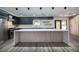 Contemporary kitchen island with waterfall edge countertop at 3180 S Tioga Way, Las Vegas, NV 89117