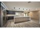 Modern kitchen with stainless steel appliances and large island at 3180 S Tioga Way, Las Vegas, NV 89117