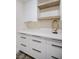 White cabinets and quartz countertops in the laundry room at 3180 S Tioga Way, Las Vegas, NV 89117