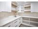 Laundry room with white cabinets and quartz countertops at 3180 S Tioga Way, Las Vegas, NV 89117