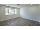 Bright and airy living area with wood-look floors at 3180 S Tioga Way, Las Vegas, NV 89117