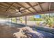 Covered patio with ceiling fans, concrete flooring and backyard views at 3180 S Tioga Way, Las Vegas, NV 89117