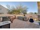 Relaxing backyard with patio furniture and grill at 3309 Jamaica Princess Pl # 3, North Las Vegas, NV 89084