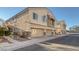 Charming townhome with multiple front-facing garages and a neutral stucco finish in a well-maintained neighborhood at 3309 Jamaica Princess Pl # 3, North Las Vegas, NV 89084