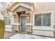 Gray front door with sidelights and landscaping at 3309 Jamaica Princess Pl # 3, North Las Vegas, NV 89084