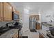 Kitchen with stainless steel appliances and wood cabinets at 3309 Jamaica Princess Pl # 3, North Las Vegas, NV 89084